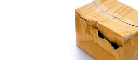 Damaged cardboard box with hole