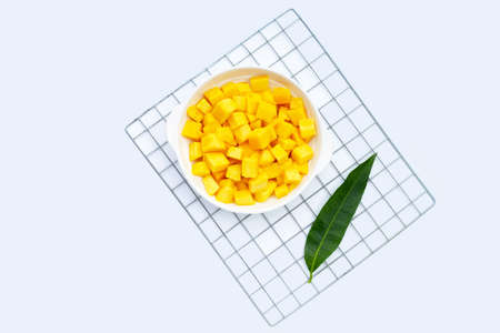 Tropical fruit, Mango cube slices in white plate on white background.の写真素材