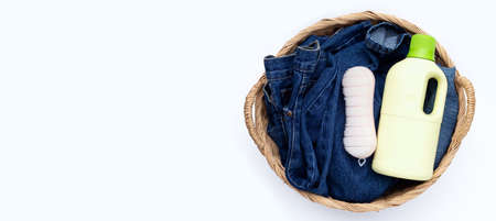 Blue jeans in laundry basketの写真素材