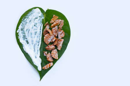 Chewing betel nut, Betel nut with cal lime powder on betel leaves