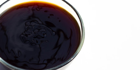 Oyster sauce in glass bowl on white background.の写真素材