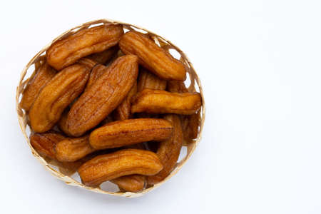Sun-dried bananas on white background.の写真素材