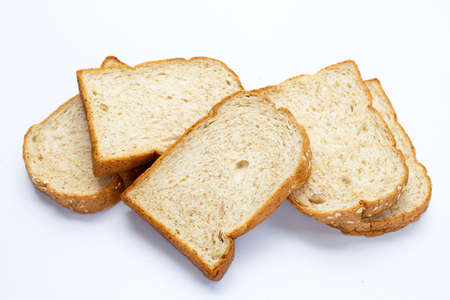Stack of sliced wholegrain bread on white background.の写真素材