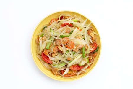 Dish of spicy papaya salad on white background.の写真素材
