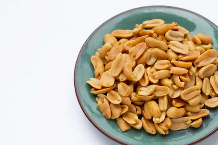Peanut in plate on white background.の写真素材