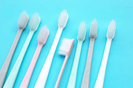 Toothbrushes on blue background. Top viewの写真素材
