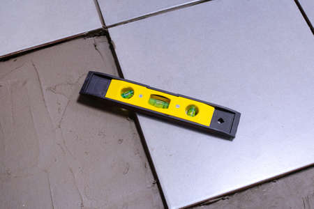 Contractor equipment on gray tiles.の写真素材