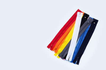 Zippers for clothing on white background.
