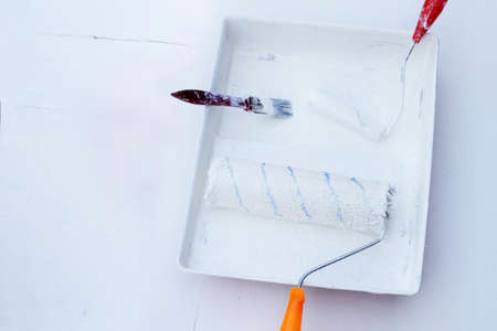 Paint rollers and brush in paint trayの写真素材
