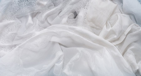 Soak a cloth before washing, white clothの写真素材