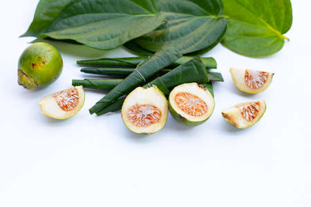 Chewing betel nut, Betel nut with cal lime powder on betel leavesの写真素材