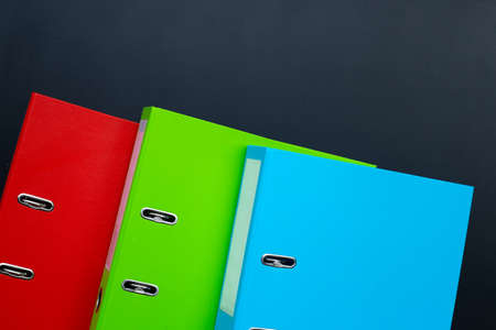 Office folders on dark background.の写真素材