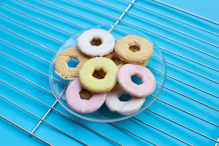 Cookie shapes donut on metal cooling rack