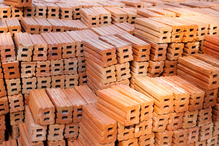 Stack of red bricks, orange clay bricks