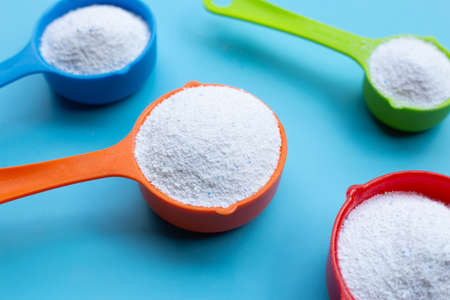 Detergent powder with measuring spoon for clothes washing. Laundry concept.の写真素材