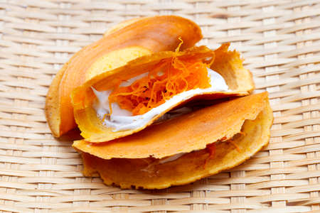 Thai crispy pancakes on white background.