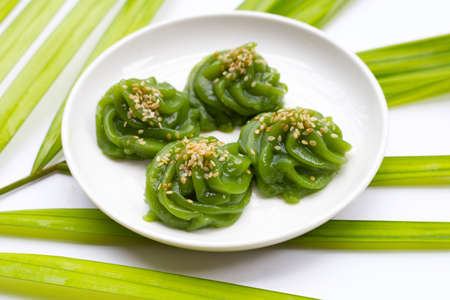 Sweet pandan pudding with white sesame seedsの写真素材