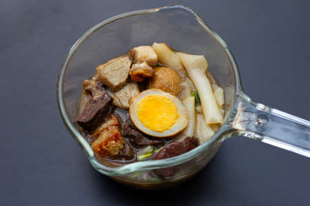 Boiled Chinese pasta square with pork soup