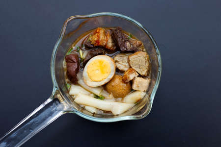 Boiled Chinese pasta square with pork soup