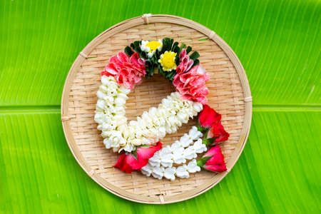 Rose with crown flower and jasmine garlandの写真素材