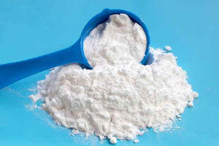Baking soda on blue background.