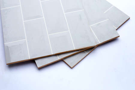 Pile of wall tiles on white background.