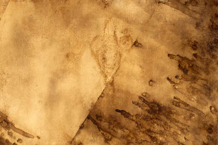 Old brown paper grunge background. Abstract liquid coffee color texture.の写真素材
