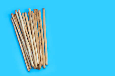 Bread sticks on blue backgroundの写真素材