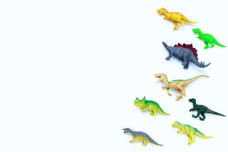 Plastic dinosaur toys on white background. Top viewの写真素材