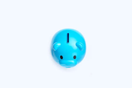 Blue piggy bank on white background.の写真素材