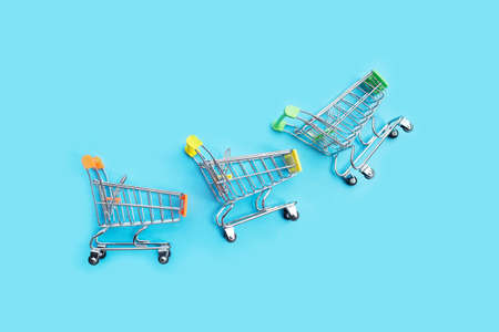Shopping trolley or Shopping cart on blue background.の写真素材
