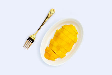 Yellow mango slices on white background.