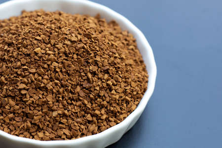 Instant coffee on dark background.