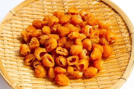 Dried longan in bamboo plateの写真素材