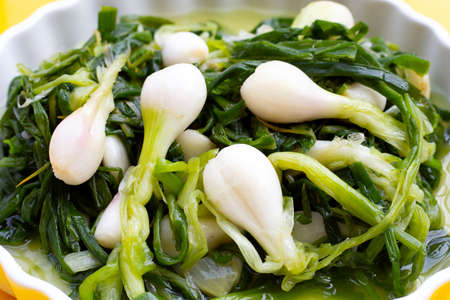 Pickled spring onion in white bowlの写真素材
