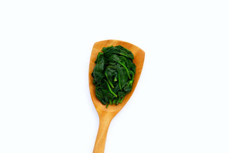 Boiled spinach on white background.の写真素材