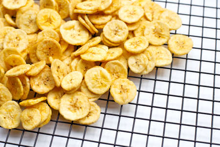 Banana slice chips on white background.の写真素材
