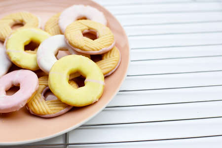 Cookie shapes donut on metal cooling rack