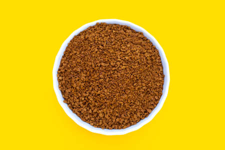 Instant coffee on yellow background.の写真素材