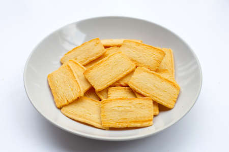 Cheese crispies on white background.の写真素材