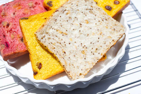 Stack of bread slices with whole grainsの写真素材