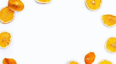 Frame made of dried orange slices on white background.の写真素材