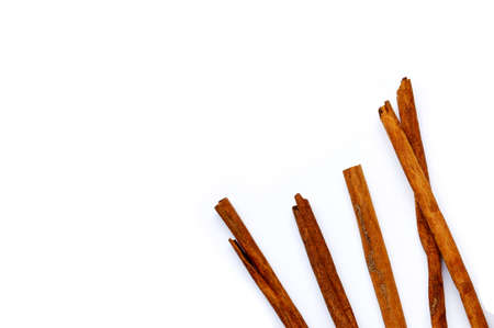 Cinnamon sticks on white background.の写真素材