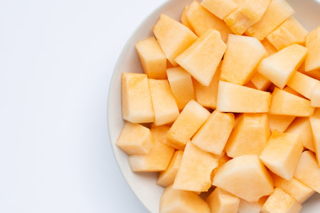 Cantaloupe melon in plate on white background.の写真素材