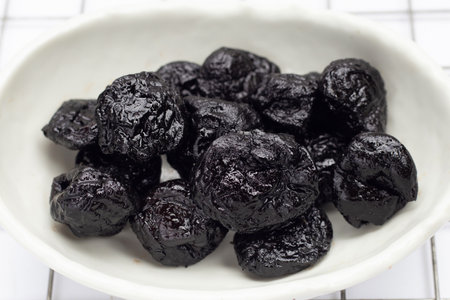 Dried prunes on white backgroundの写真素材
