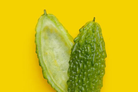 Bitter melon on yellow background.の写真素材
