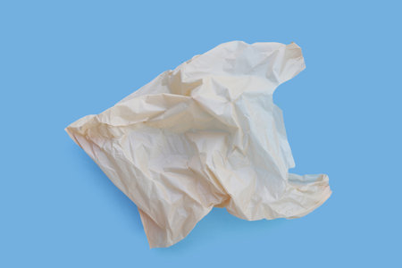 Plastic bag on blue background. Copy space