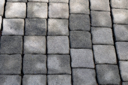 Gray concrete pavers, ideal for walkways, patios, or driveways.