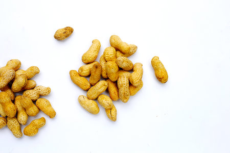 Peanuts in shell on white background.