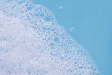 Blue water with white foam bubbles